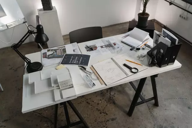 Office workdesk with books, documents and stationery